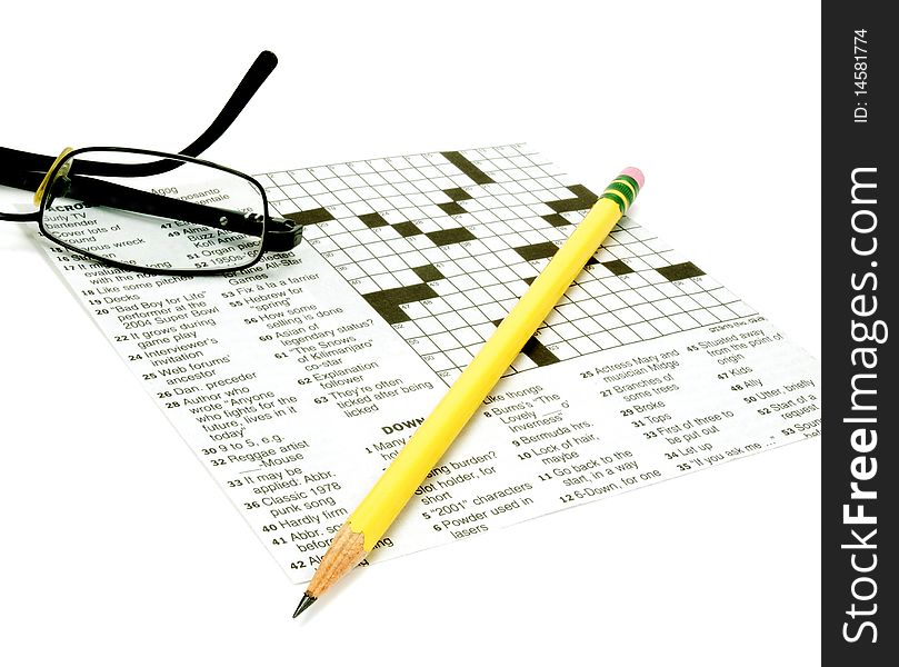Glasses and pencil on crossword puzzle. Glasses and pencil on crossword puzzle