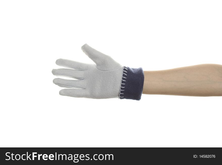 Blue warm winter glove wearing the women's arm. Isolated on white background. Blue warm winter glove wearing the women's arm. Isolated on white background