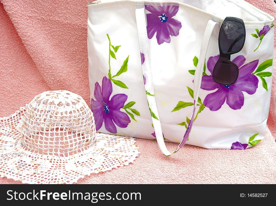 The  women bag with sun hat and sunglas
