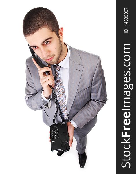 Portrait of young businessman with black telephone. Portrait of young businessman with black telephone