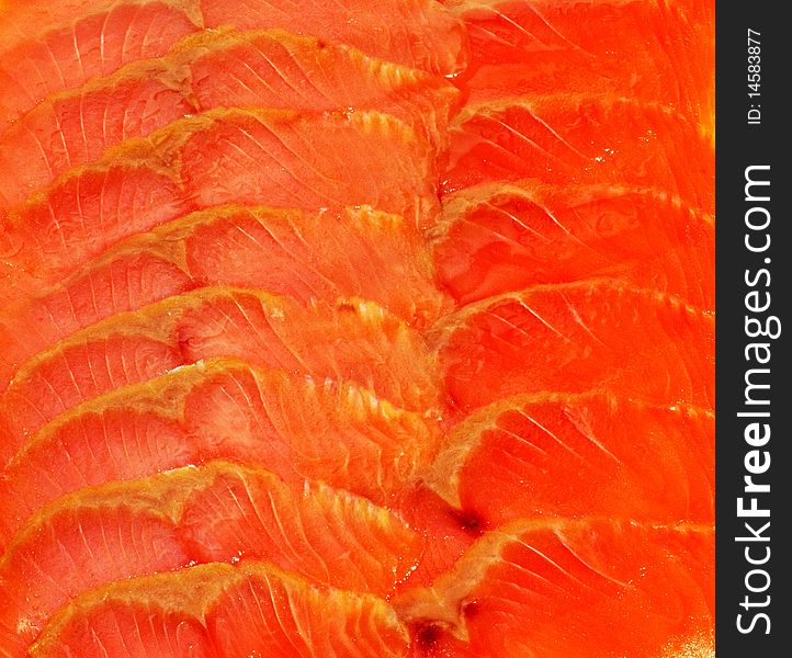 Slice of a fresh orange salmon background