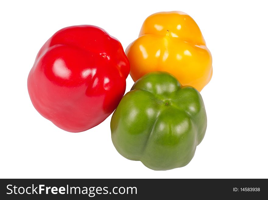 Three colorful pepper back isolated in white