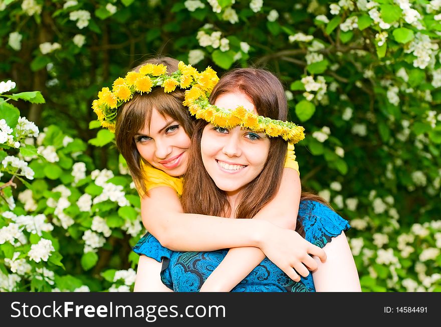 Portrait of young smiling women in garlands. Portrait of young smiling women in garlands