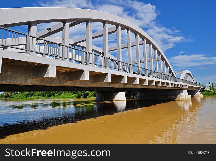 White and concrete bridge across the river