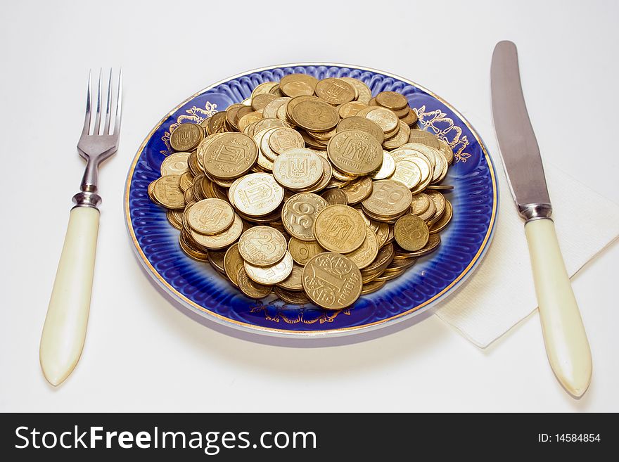 Breakfast with coins in the plate. Breakfast with coins in the plate