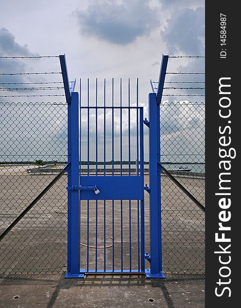 Blue gate at the sea side