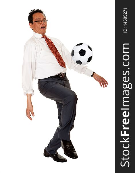 Businessman plays soccer, sport in the elegant suit before white background