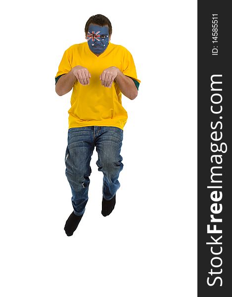 Man with australian shirt and australian flag on his face pretending to be a kangaroo, jumping isolated on white background. Man with australian shirt and australian flag on his face pretending to be a kangaroo, jumping isolated on white background