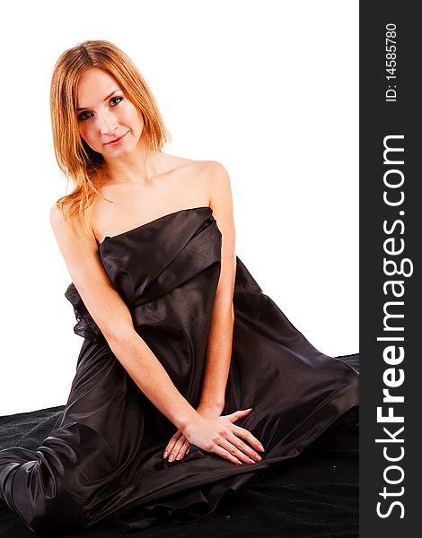 Picture of a alluring charming young girl on black bed. Picture of a alluring charming young girl on black bed