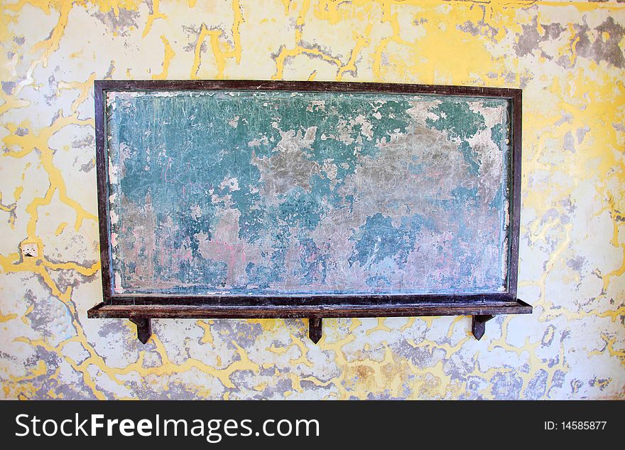 School chalkboard in shabby classroom