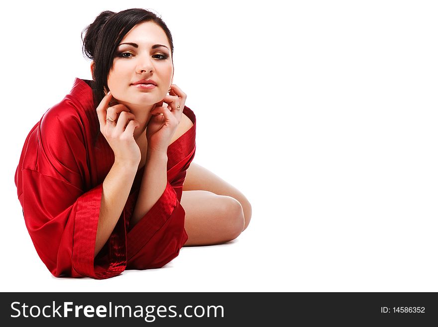 Picture of sensuality young woman in red gown on white background.