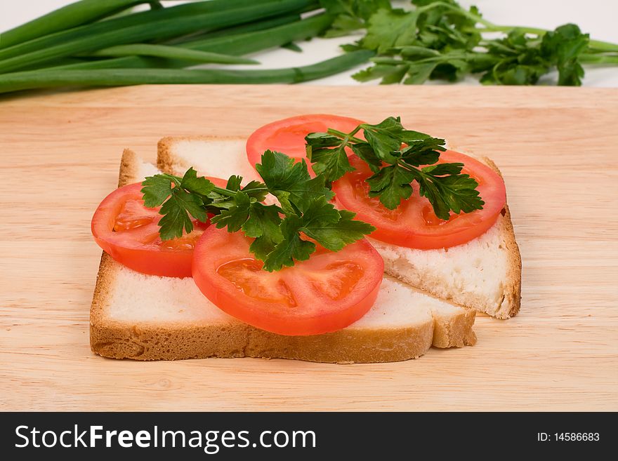 Tasty sandwiches with sausage, tomatoes and herbs