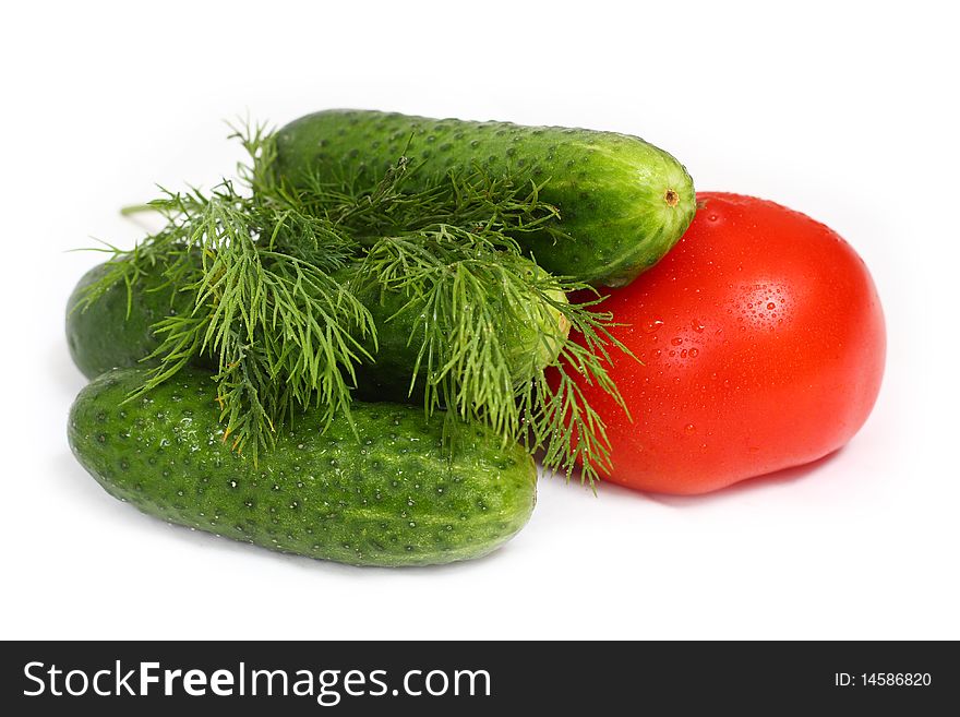 Red tomato and cucumber isolated on white background