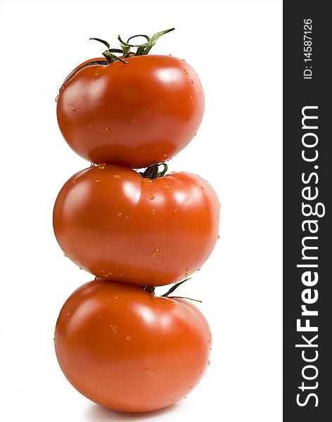 Three tomatoes on white background