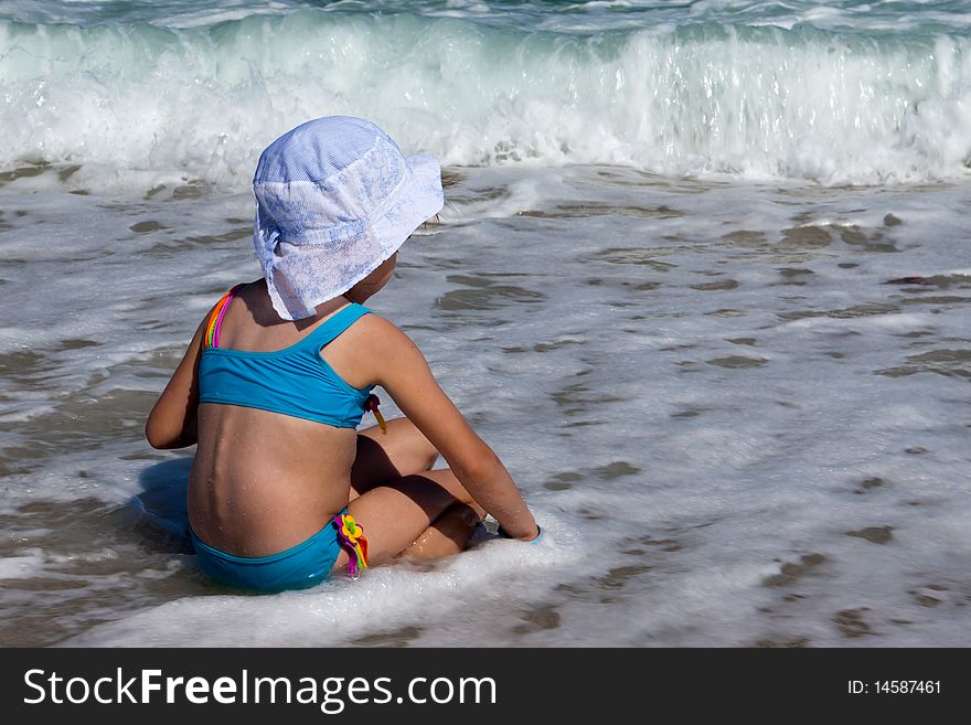 The girl plays to a surf strip. The girl plays to a surf strip