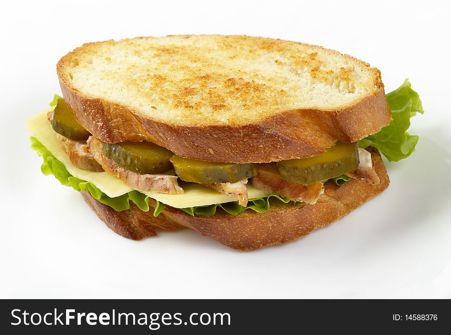 Sandwich with fried chicken and pickle cucumber isolated over white background. Sandwich with fried chicken and pickle cucumber isolated over white background
