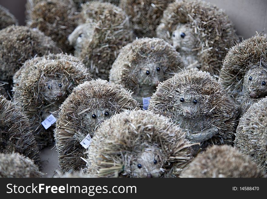 Cute hand made hedgehogs toys or souvenirs made of natural materials. Cute hand made hedgehogs toys or souvenirs made of natural materials.