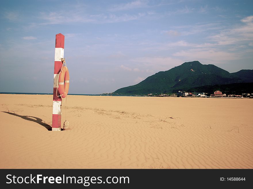 Lifeguard Post On Beach With Mountain Background