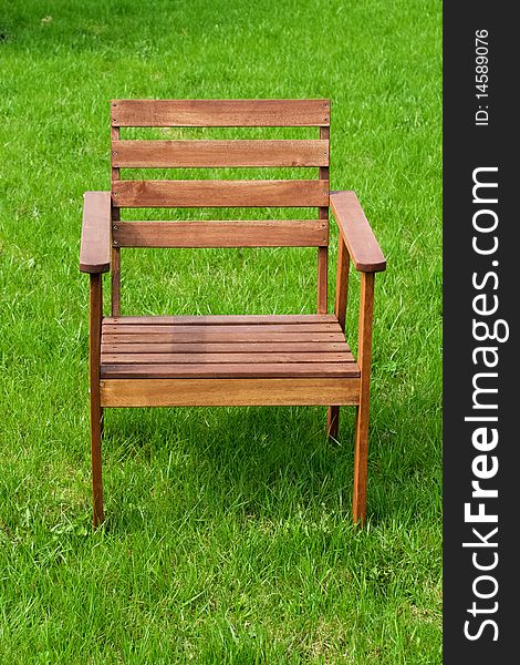 Wooden chair on green grass