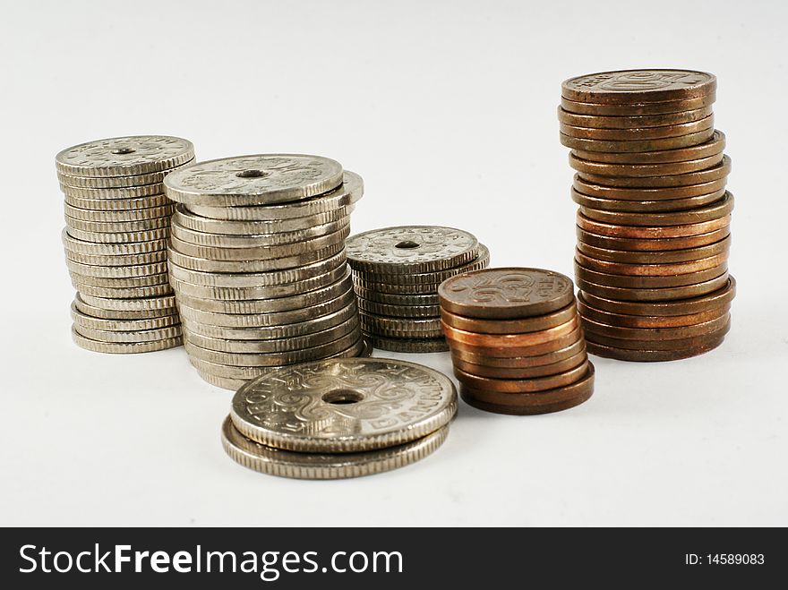 Stacks of Danish coins on white background