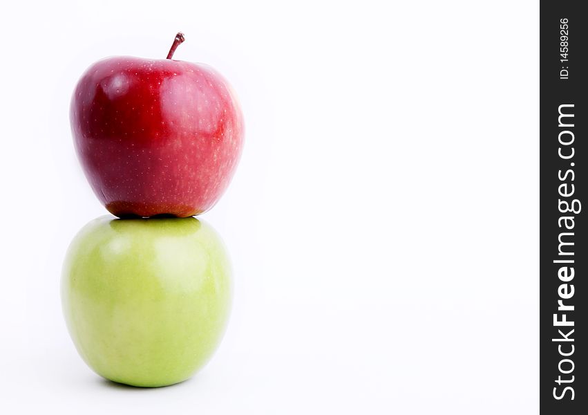 Red and green apple on white background. Space to insert text or design. Concepts: Food, Nutrition & Wellness