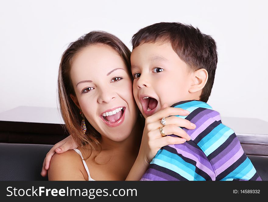 Child and his mother playing and smiling. Child and his mother playing and smiling