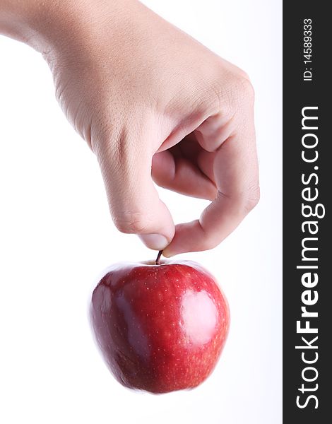 Red apple on man hand over white background. Concepts: Nutrition, Food, Health & Wellness