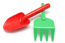 Red Shovel And Green Rake Isolated Stock Photo