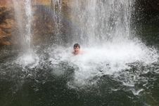 Rainbow, Waterfall And Swimming Person Stock Photos