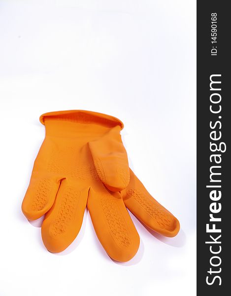 Orange single glove on the white. Orange single glove on the white.