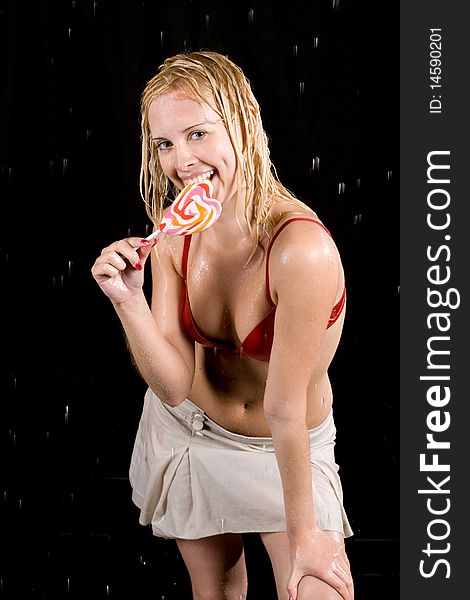 Girl with lollipop in aqua studio