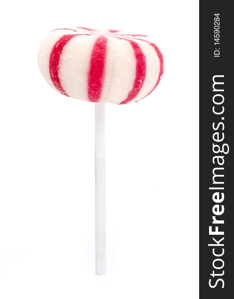 Pink and white candy lollipop isolated over white