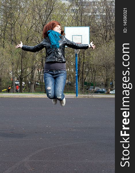 Girl jumping outdoor with joy