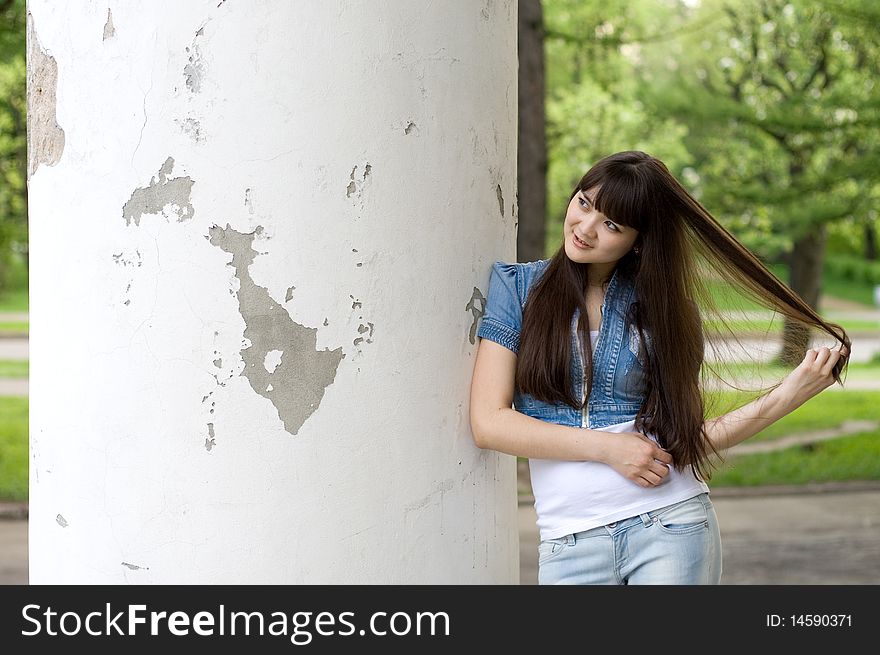 Girl standing near column