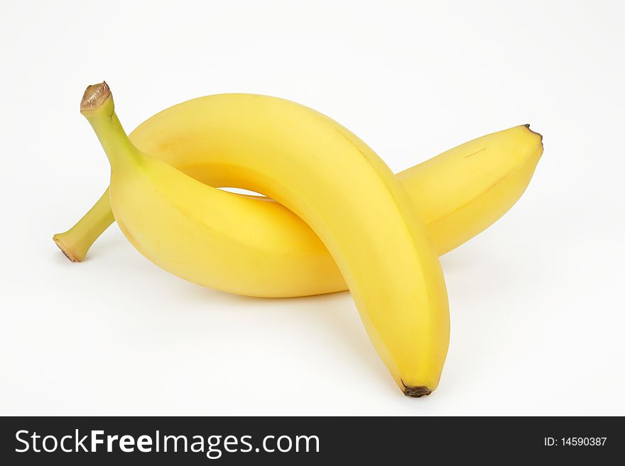 Two ripe bananas on a white background. Two ripe bananas on a white background