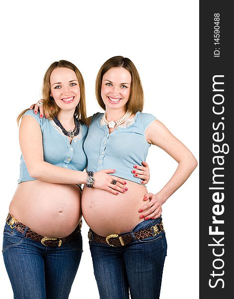 Two pregnant women (sister-twins) isolated on white. Two pregnant women (sister-twins) isolated on white