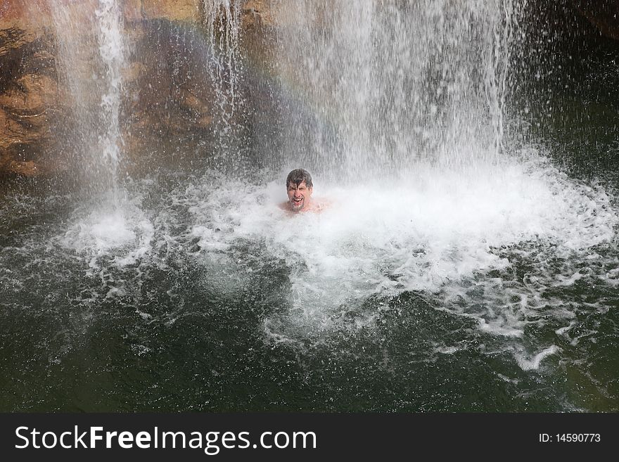 Rainbow, Waterfall And Swimming Person