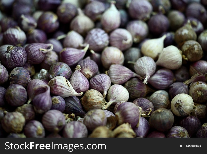 Violet shallots on a market table