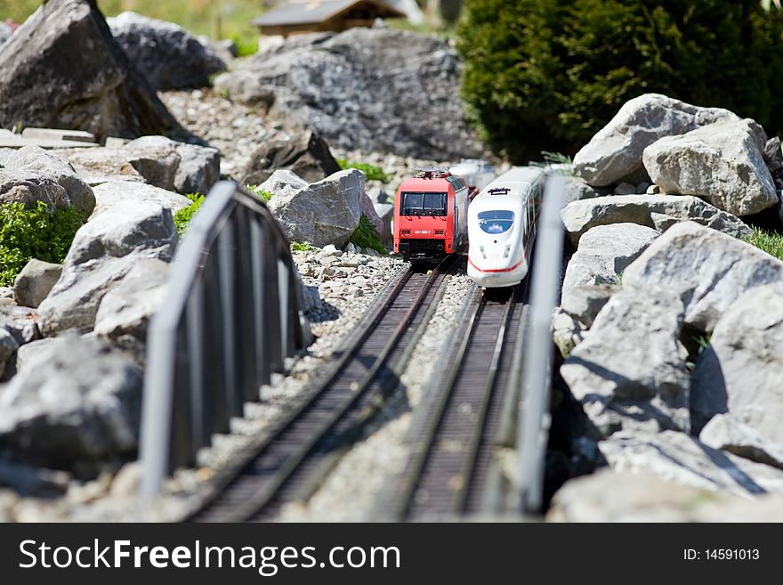 Photo of two toy trains, outside imitation