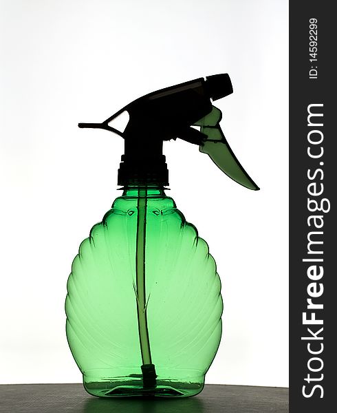 Green plastic pulverizer, empty, back lighting