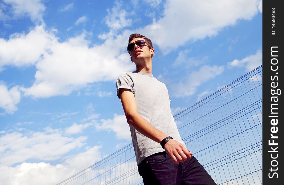 Young man walking outside