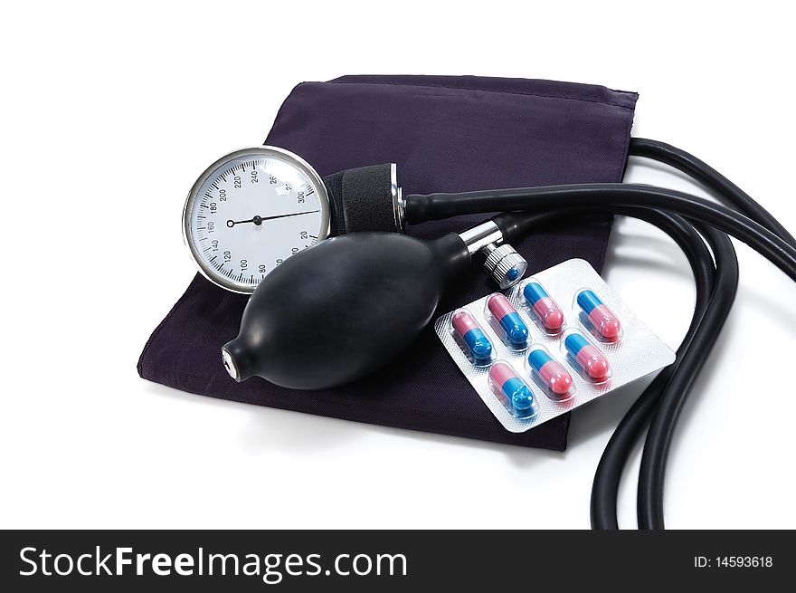 Medical blood pressure with pills isolated on white background. Medical blood pressure with pills isolated on white background