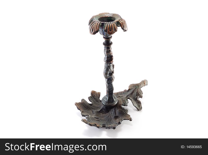 Old metal candle holder isolated on a white background