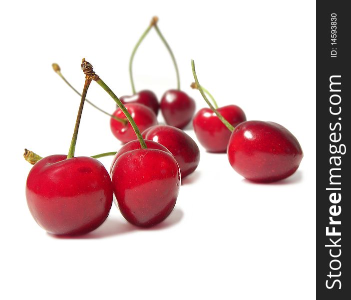 Juicy cherries isolated on white background