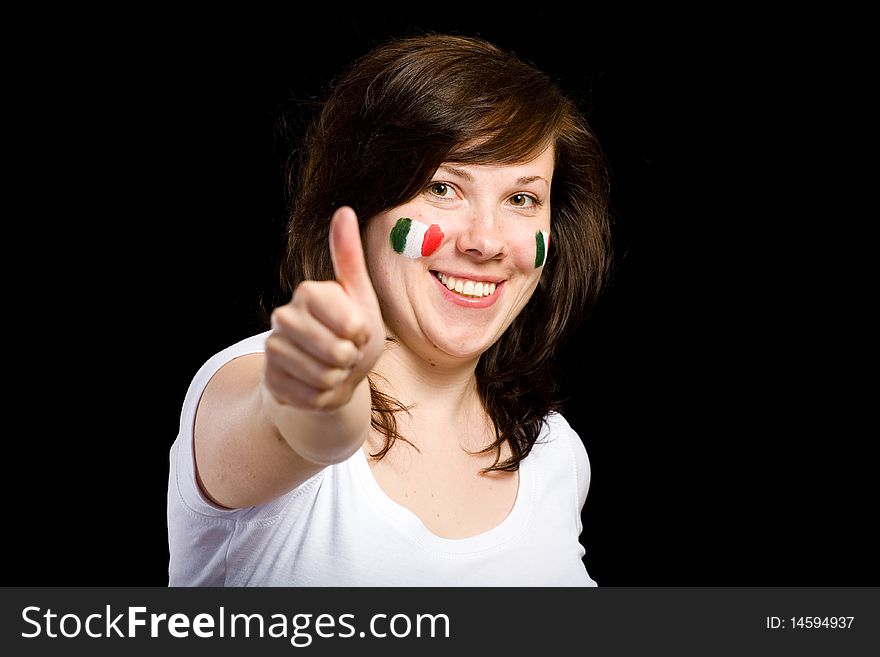 Young female show thumb up gesture, italian team supporter with flags on her cheeks, studio shoot isolated on black. Young female show thumb up gesture, italian team supporter with flags on her cheeks, studio shoot isolated on black