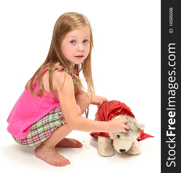 Adorable five year old girl playing with her wonder dog.