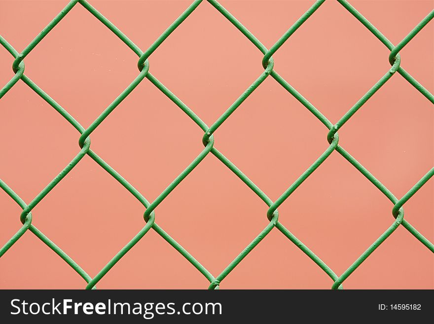 Close-up green chain link fence. Close-up green chain link fence