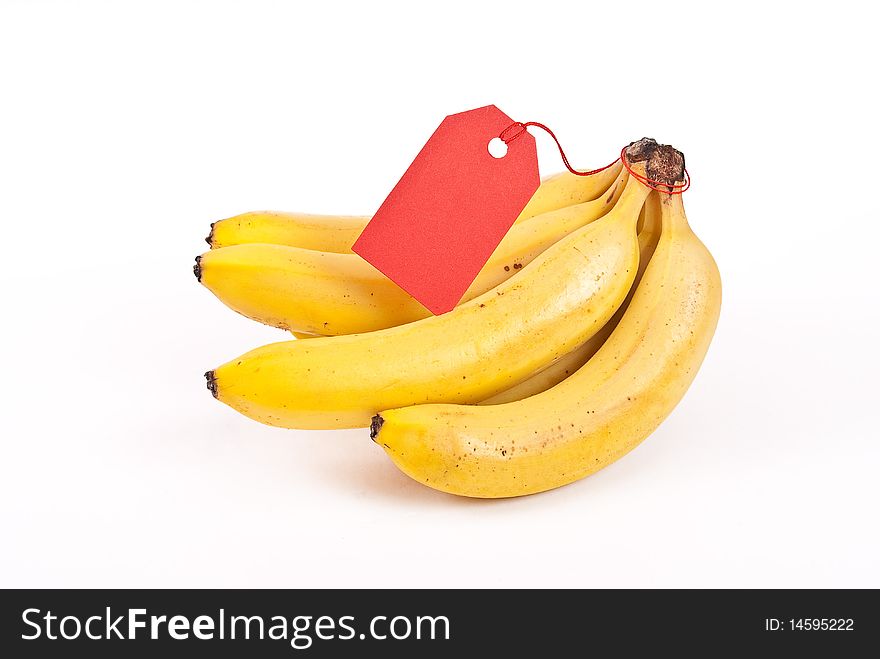 Bunch of bananas with tag on white