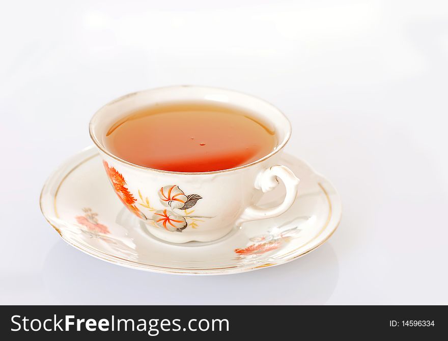 Cup of tea over white background
