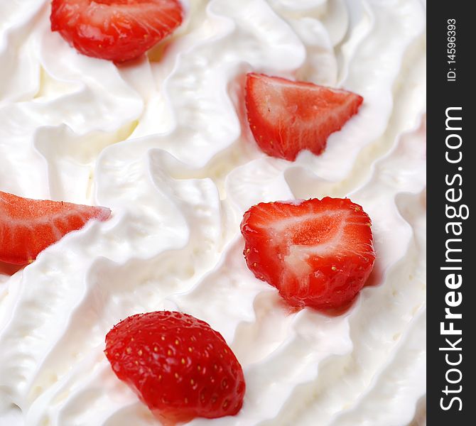 Fresh strawberries on cream high resolution image